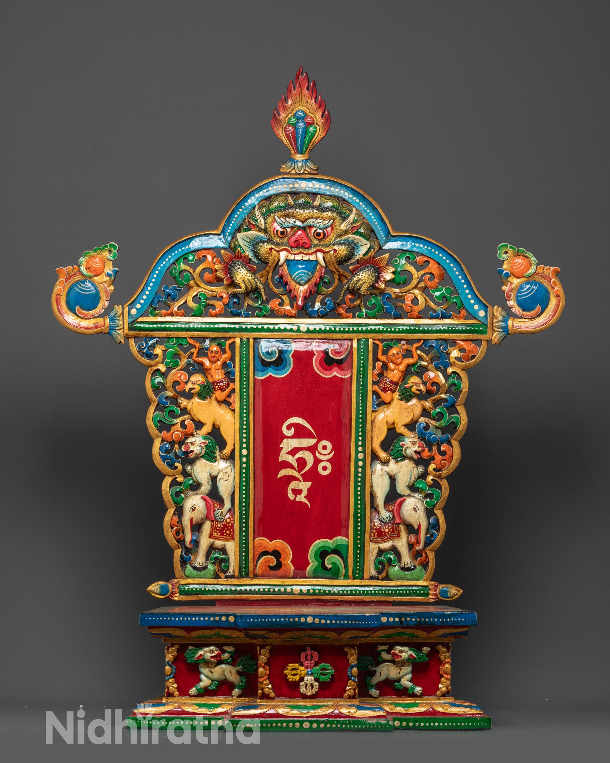 Front view of handcrafted Buddhist wooden throne with acrylic painted details
