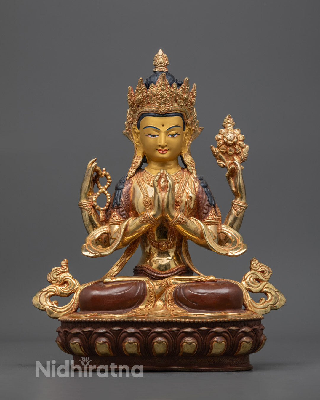 handcrafted Chenrezig Statue with 24k gold-gilded face seated on a lotus throne, symbolizing compassion and spiritual grace