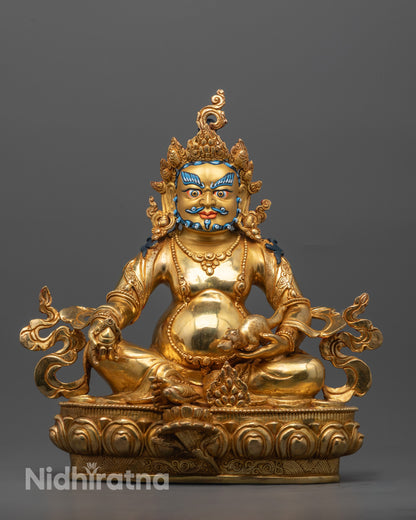 Front view of handcrafted Dzambhala Statue seated on a lotus throne, holding a citron fruit