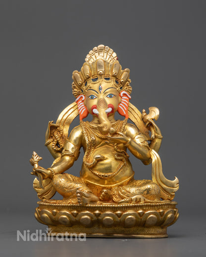 Front view of handcrafted Ganesha statue with gold-gilded face and detailed carvings