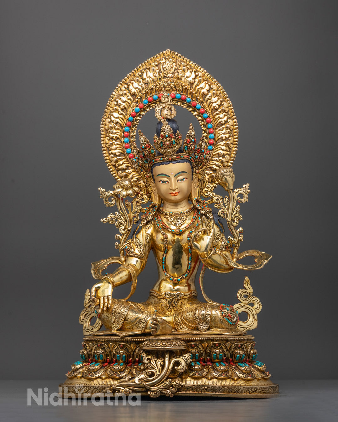 Front view of handcrafted Green Tara statue with gold gilding and gemstone details