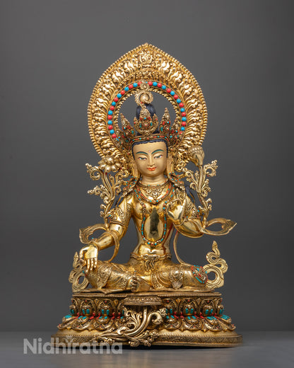 Front view of handcrafted Green Tara statue with gold gilding and gemstone details