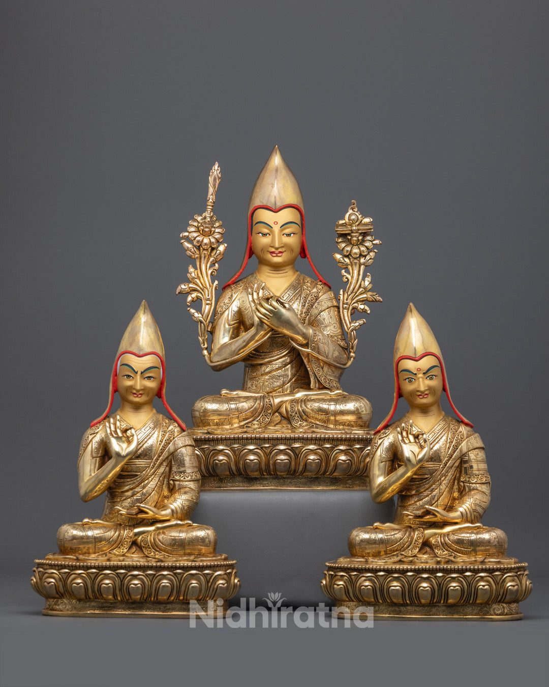 Front view of handcrafted Je Tsongkhapa statue set with gold fire-gilded details and disciples.