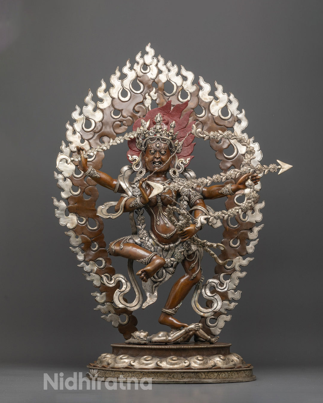 Front view of handcrafted Kurukulla sculpture with silver-plated halo and intricate details