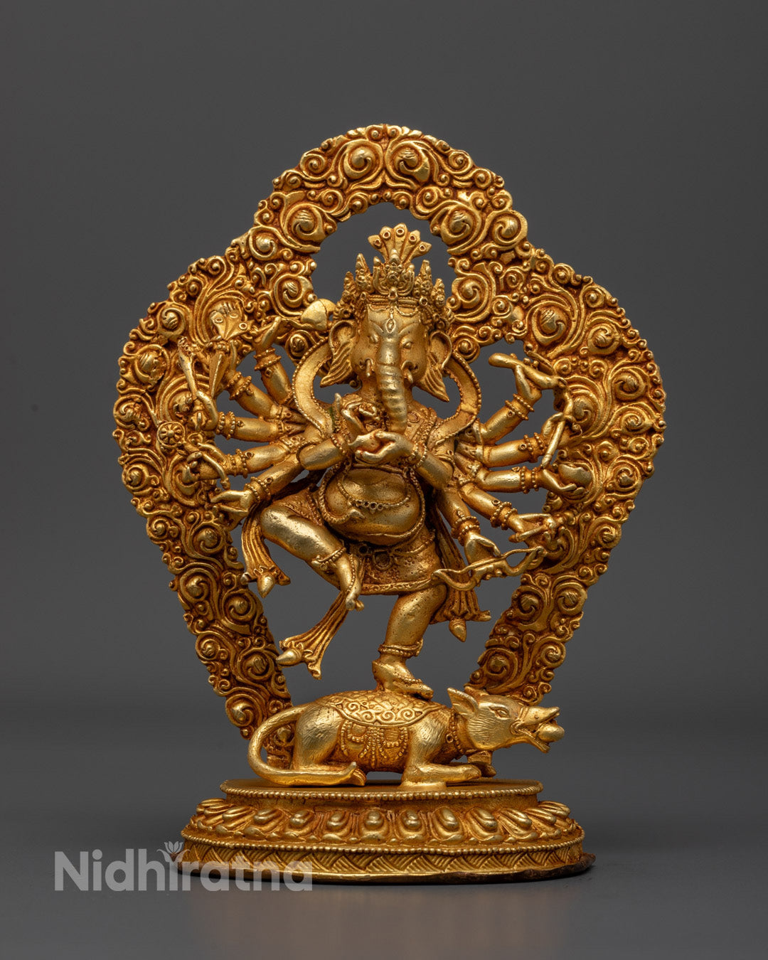 handcrafted Lord Ganesha statue with gold gilding and acrylic colors, seated on a lotus throne.