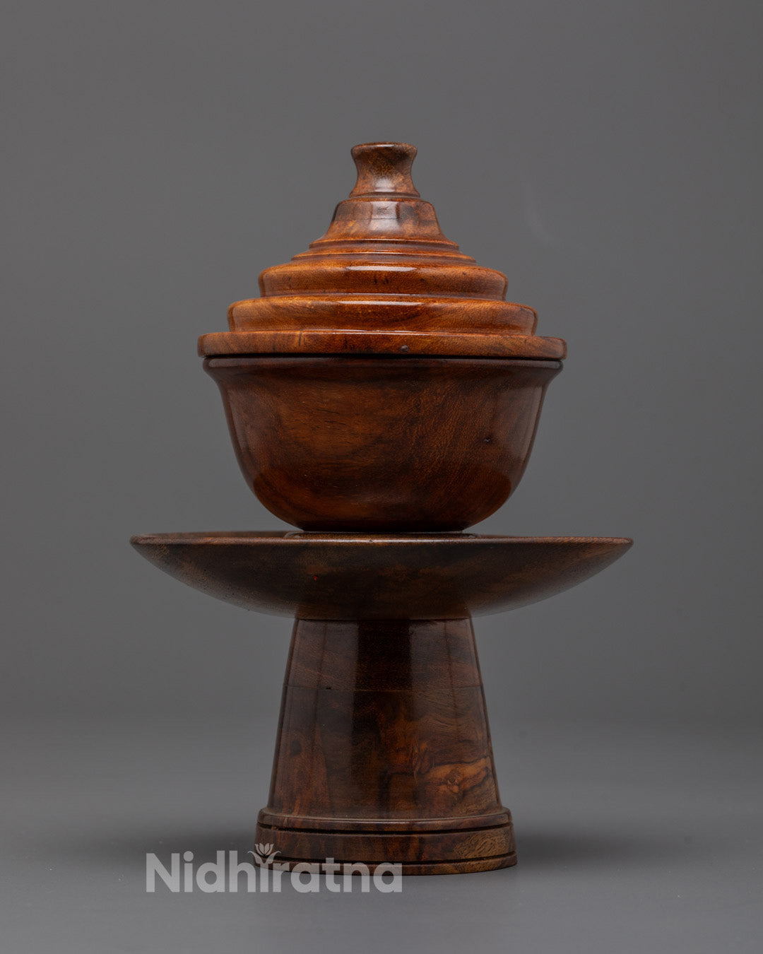 Front view of handcrafted Tibetan wooden tea bowl with polished dark brown glossy finish