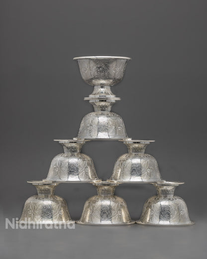 Front view of handcrafted pure silver water offering bowl with intricate carvings