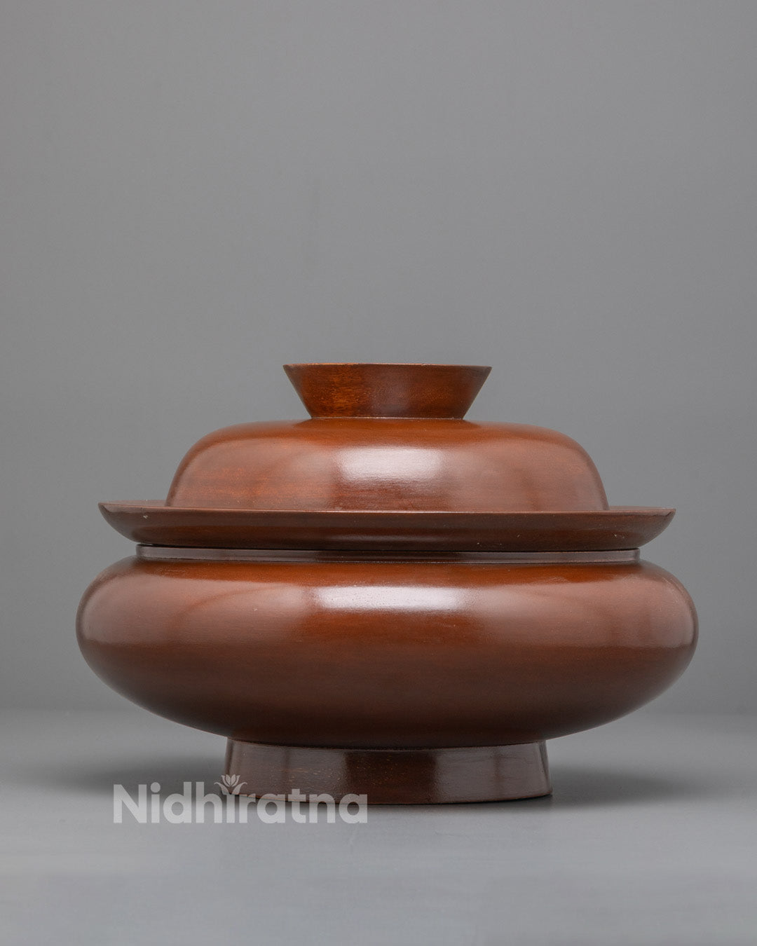 Front view of handmade Tibetan Paru wooden ritual bowl from Patan, Nepal
