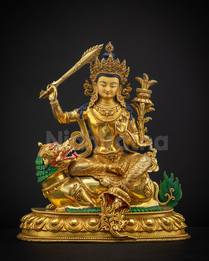 Front view of lion-seated Simhada Manjushri statue in gold fire gilding surface