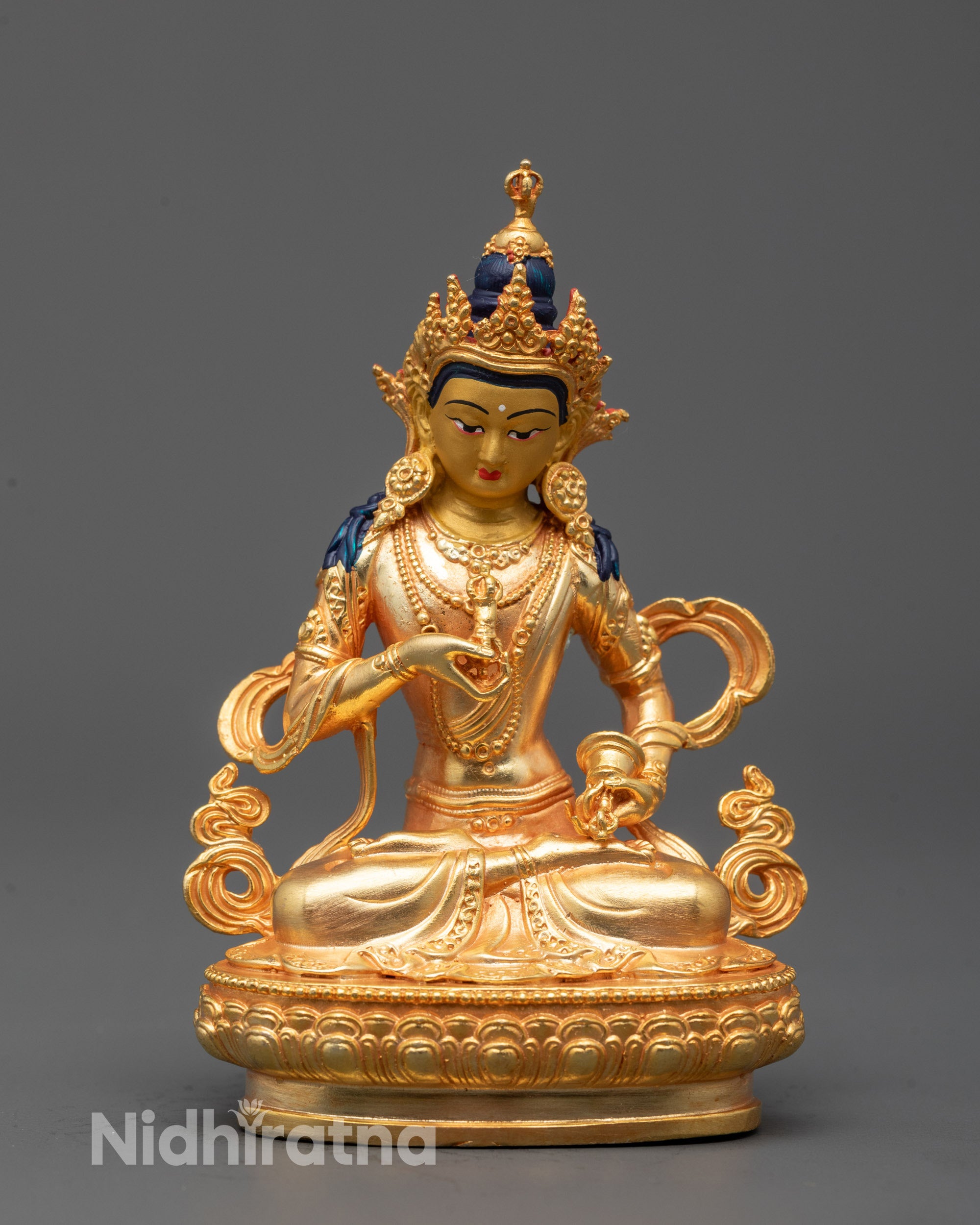 Front view of machine-crafted Vajrasattva statue with gold-plated body and calm expression