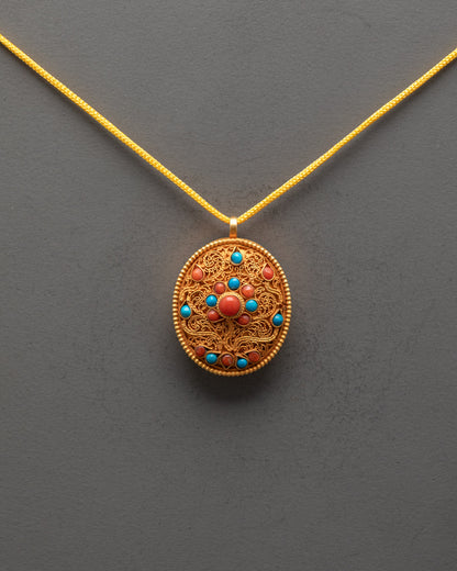 Front view of oval Sacred Tibetan Locket Pendant with gold filigree and turquoise, coral stones
