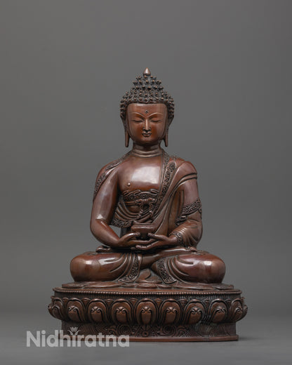 Front view of oxidized Amitabha Buddha statue seated in dhyana mudra with fine carved details