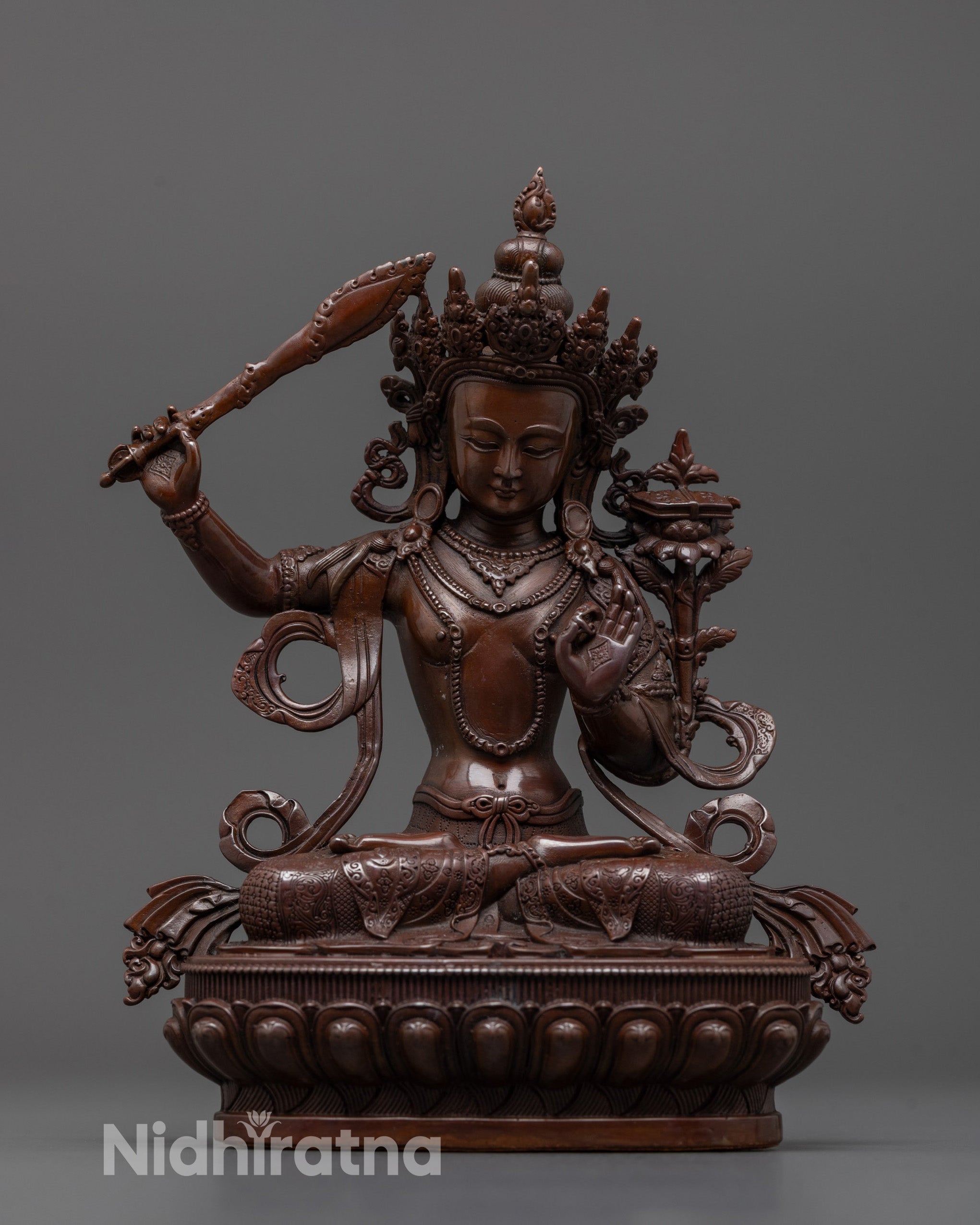 Front view of oxidized Manjushri statue showing detailed machine-crafted electroplated surface