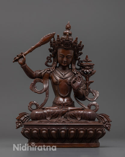 Front view of oxidized Manjushri statue showing detailed machine-crafted electroplated surface