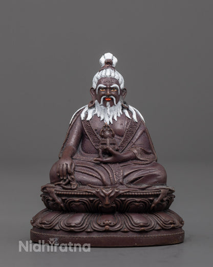 Front view of oxidized Thang Tong Gyalpo statue with lotus base and detailed carvings