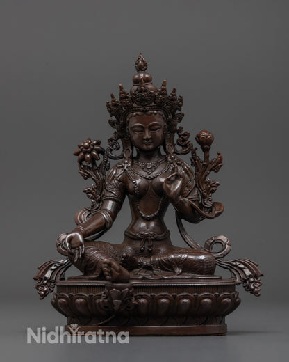 Front view of oxidized copper Green Tara statue in royal ease pose with rich antique finish