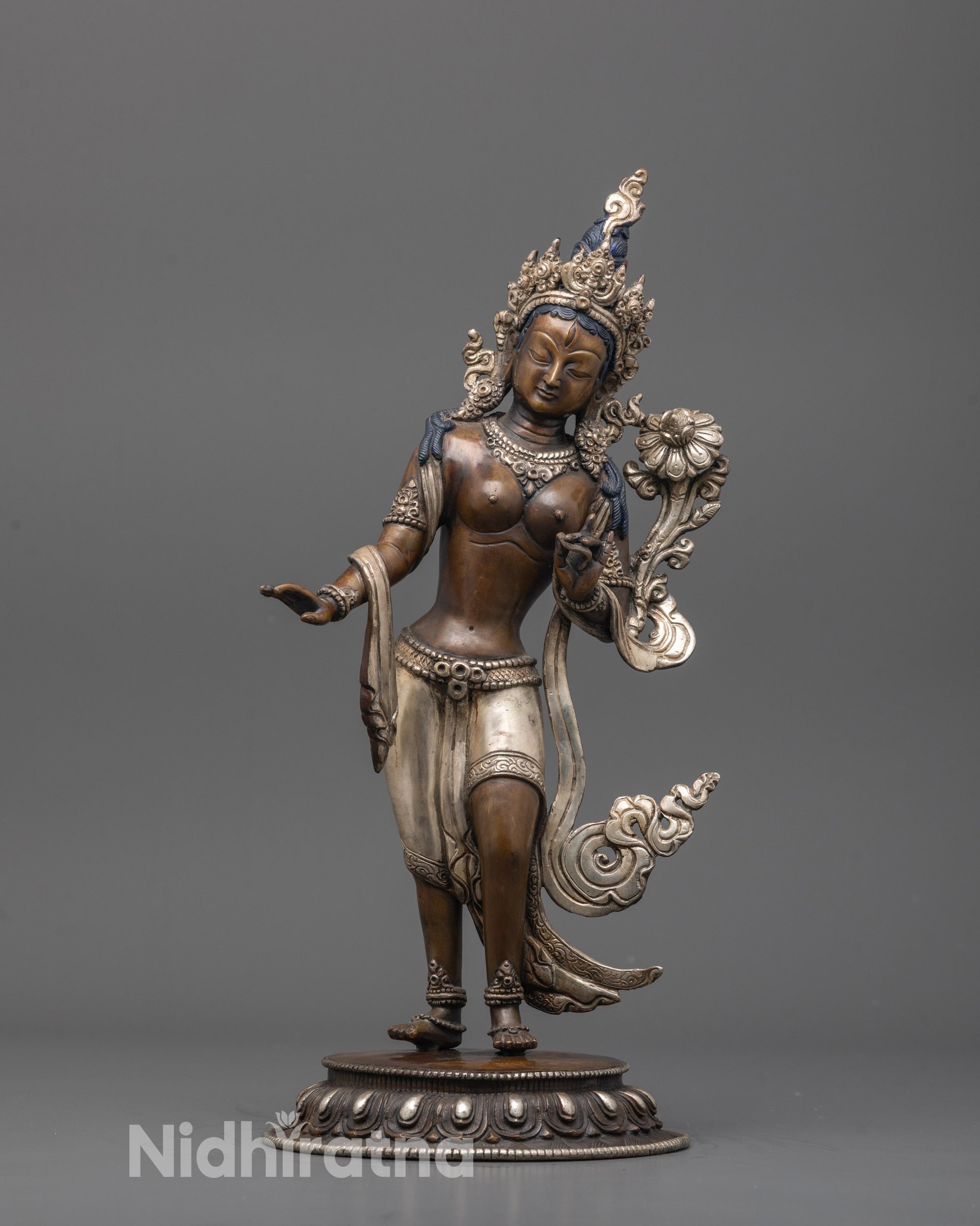 Front view of oxidized copper Standing Green Tara statue with silver-plated crown and lotus seat