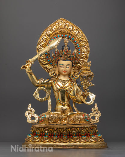 Front view of premium Tibetan Manjushri statue with gold gilding and semi-precious stones