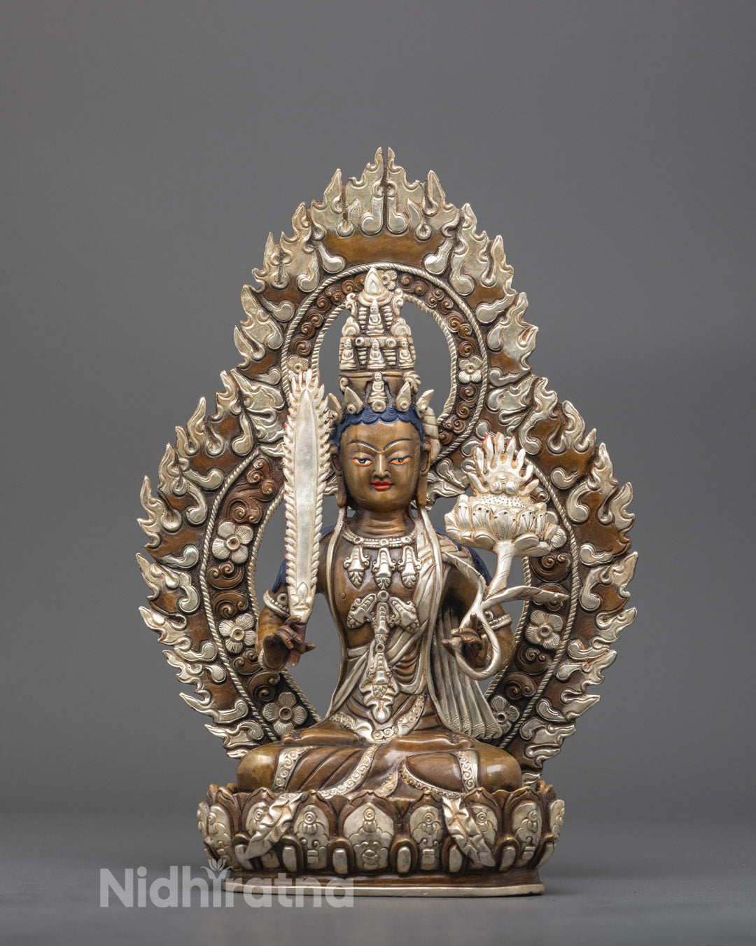 Front view of silver-plated Broken Vows Purifier Akasagarbha Bodhisattva statue with sword