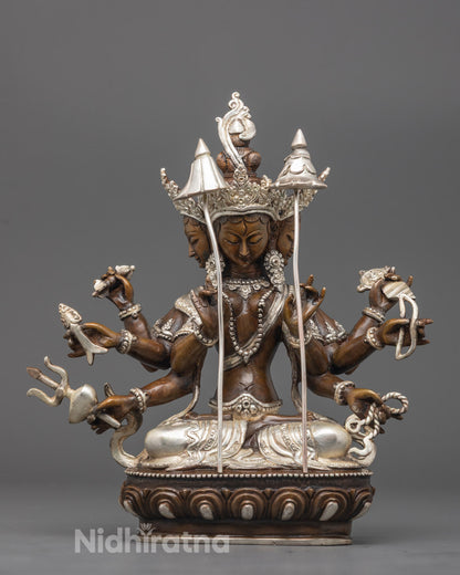 Front view of silver-plated Jetsun Dukkar Statue seated on lotus throne with symbolic objects