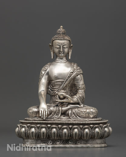 Front view of silver-plated Shakyamuni Buddha Statue seated on lotus base