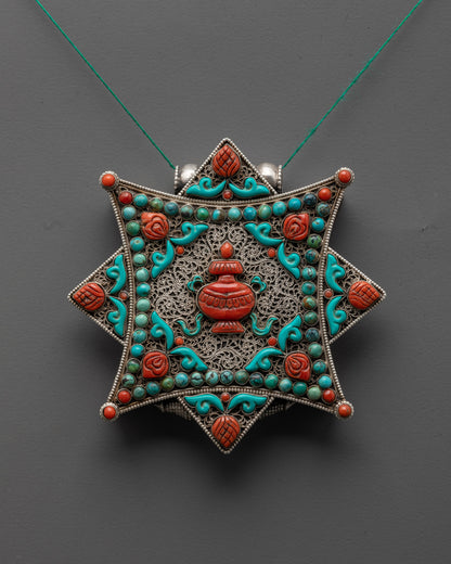 Front view of silver Kalash locket with turquoise vase and coral stone accents