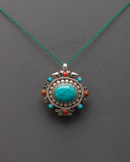 Front view of silver turquoise locket with coral stones, handcrafted by Himalayan artisans in Nepal