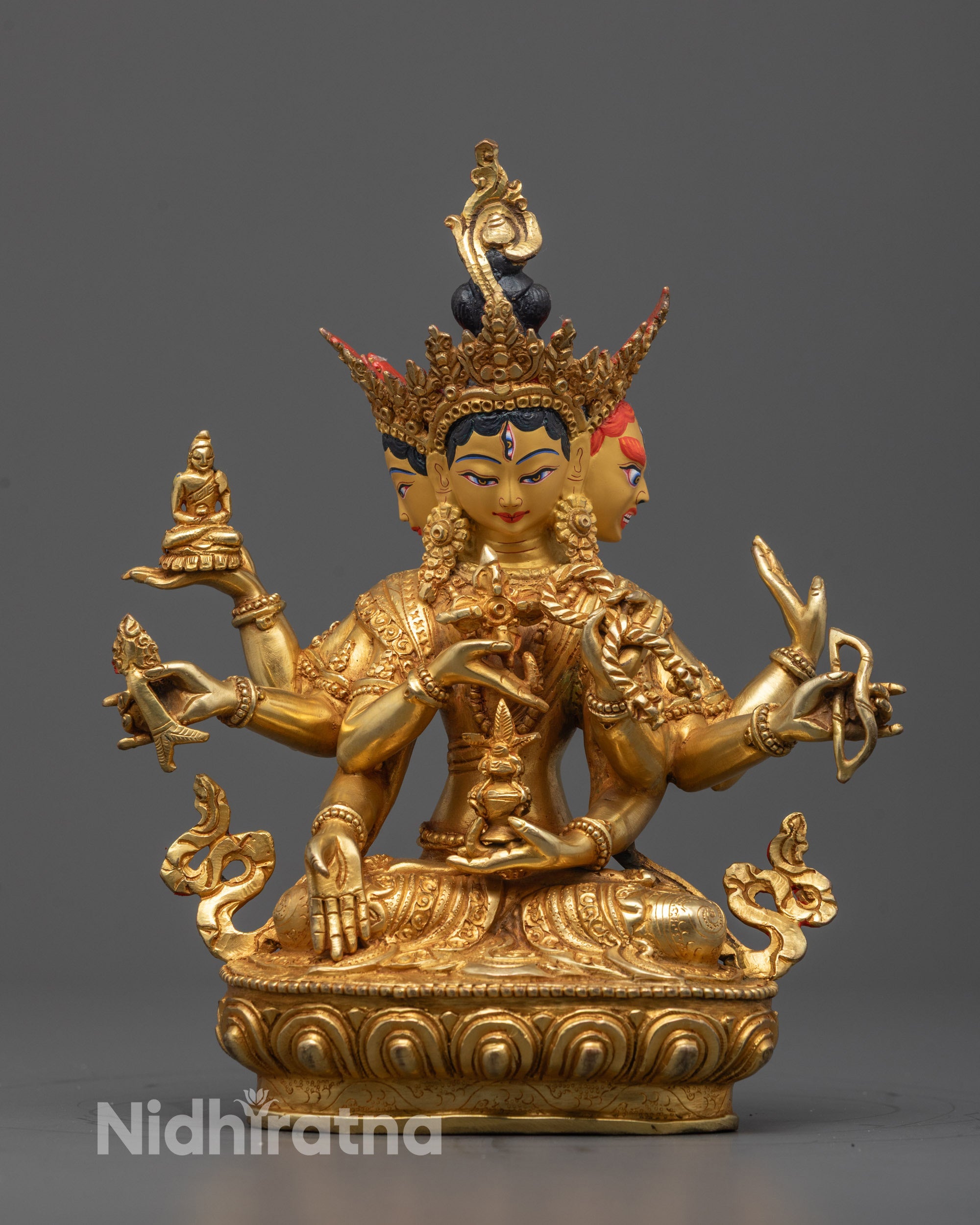 Front view of the Namgyalma Sculpture seated on a lotus throne, holding a sword of wisdom
