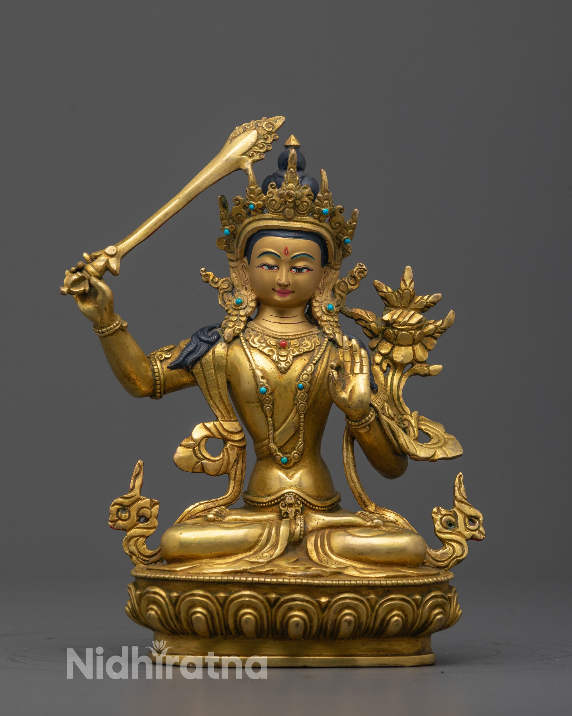 Front view of the hand-carved Manjushri Statue seated on a lotus throne
