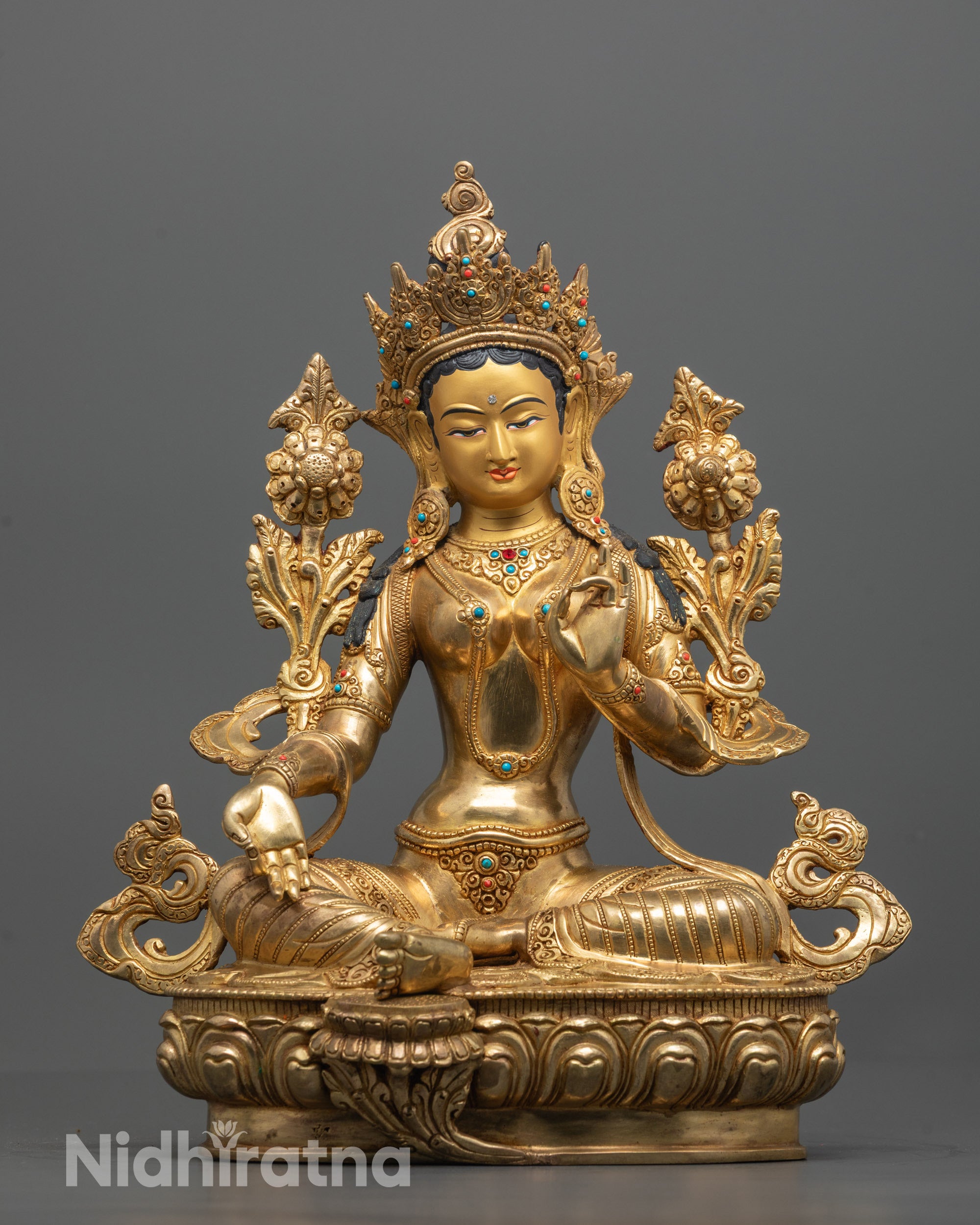 Front view of the handcrafted Green Tara Statue seated peacefully on a lotus base