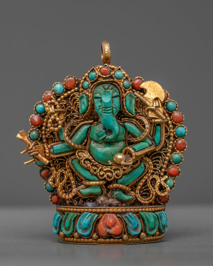 Front view of turquoise Ganesha locket with gold-gilded filigree and semi-precious stones