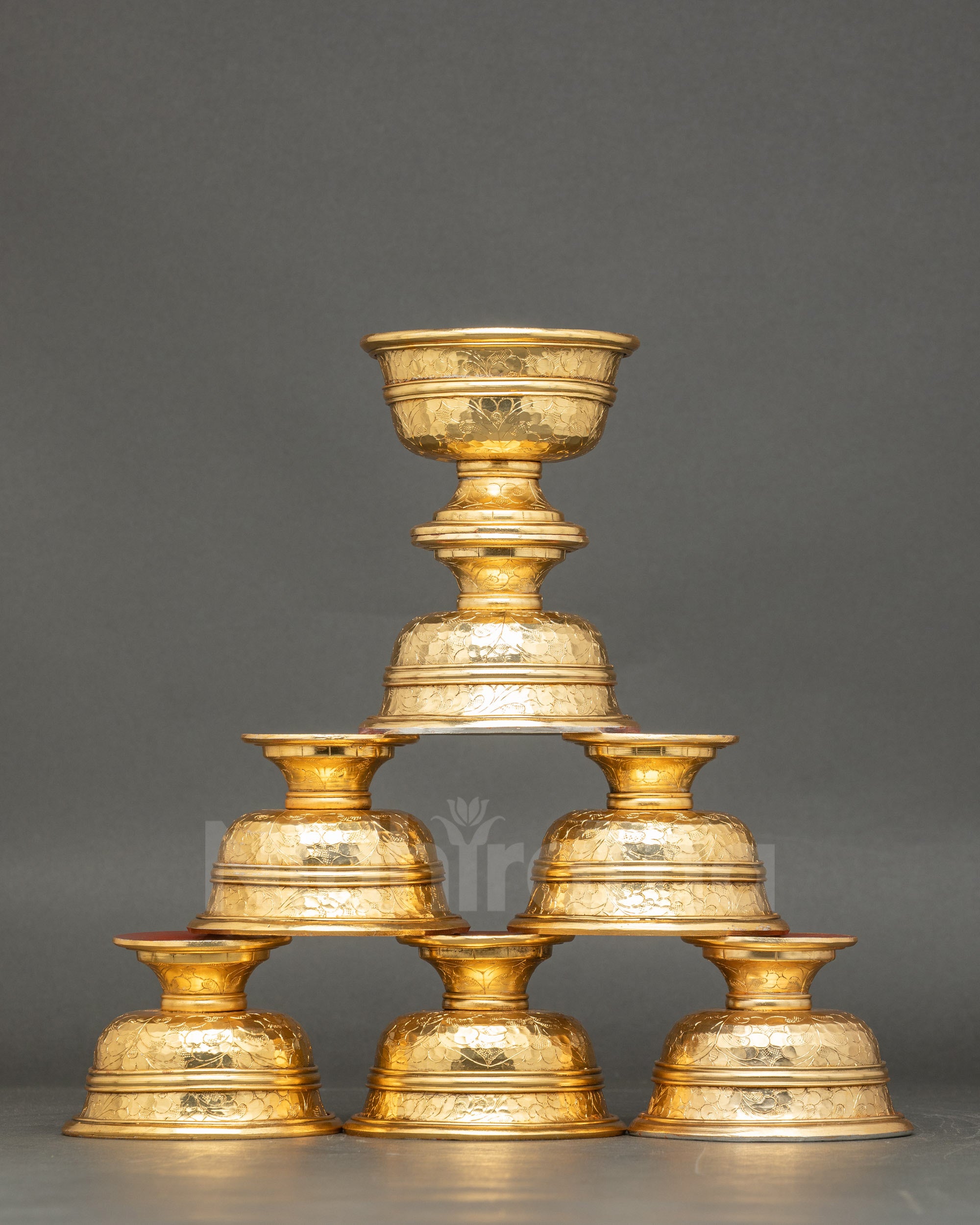Front view seven bowl water offering set gold and silver-plated Tibetan Buddhist altar