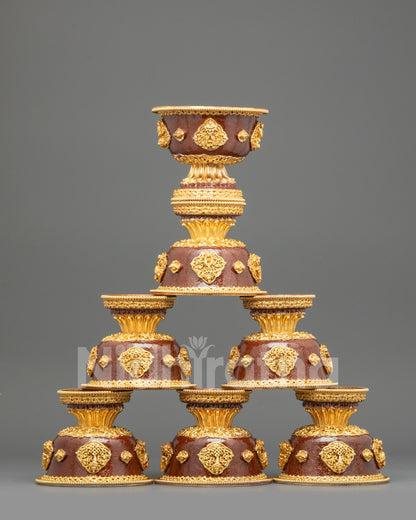 Front view seven sets of gold-plated Tibetan water offering bowls on pedestal for Buddhist altar