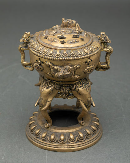 Full side profile of handmade brass dhoop burner with elephant trunk stand lotus seat Nepal