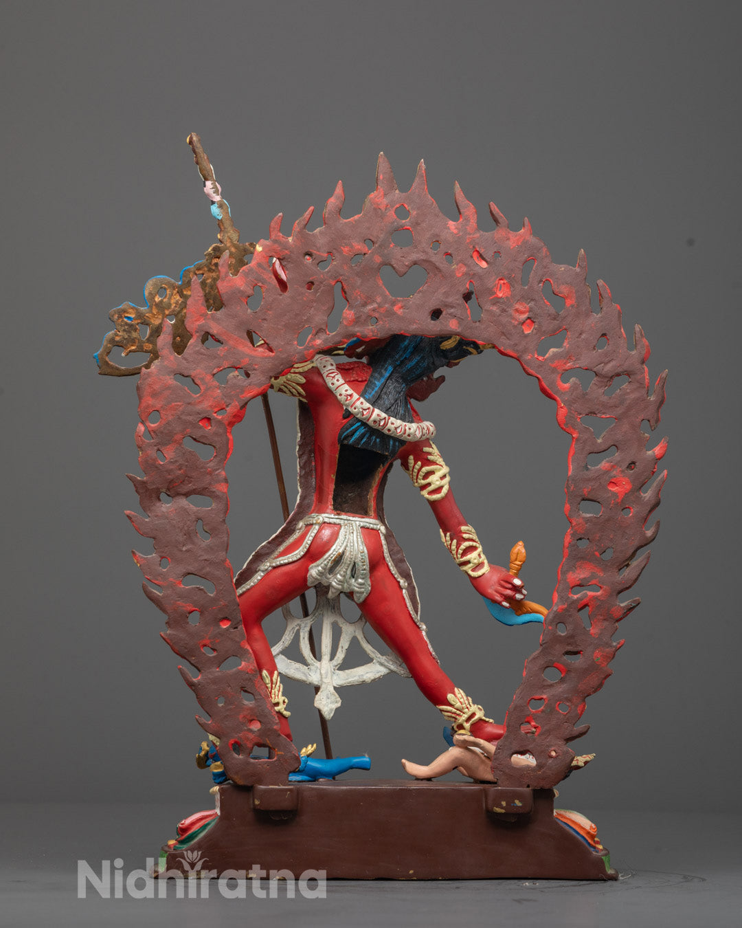 Full-body view of red Vajrayogini Statue resting on lotus base, featuring hollow chamber