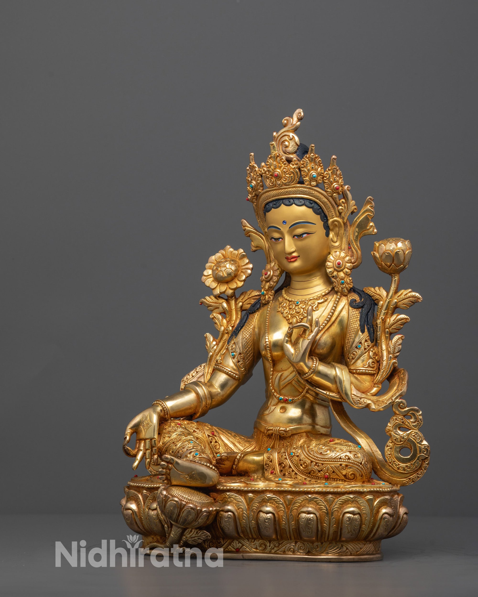 Full Green Tara Statue showing intricate details of lotus seat and hand gesture