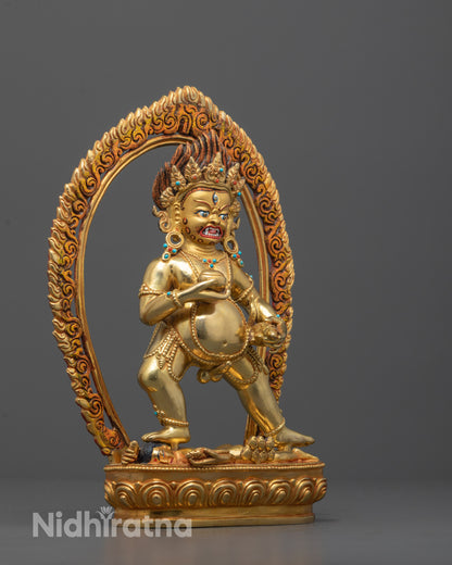 Full View of Black Dzambhala Statue with Human Deity Underfoot