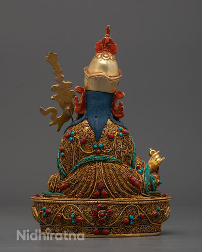 the radiant Guru Rinpoche Statue adorned with semi-precious stones, symbolizing protection and spiritual awakening.