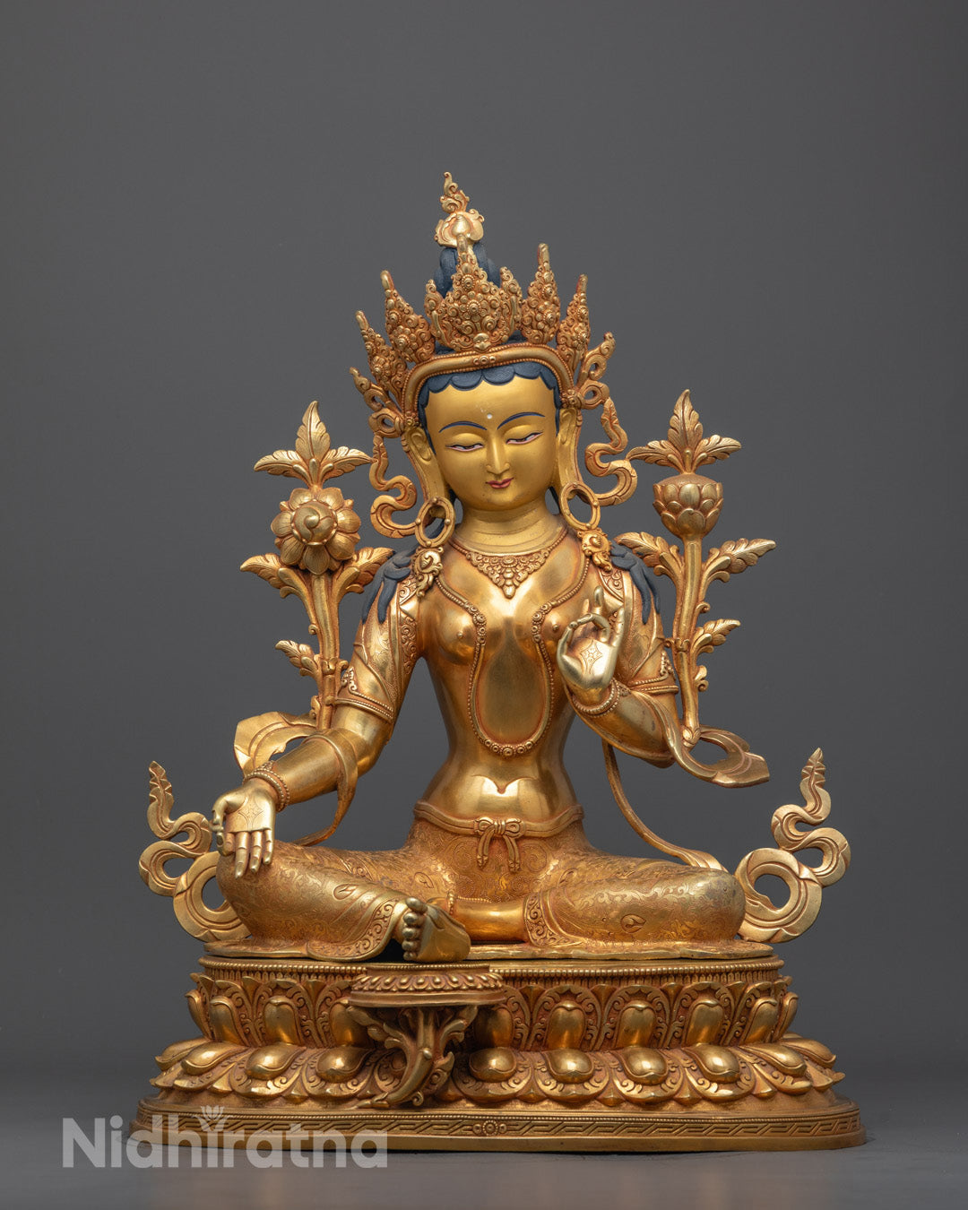 Full image of Green Tara Statue seated on lotus base with 24k gold-gilded face