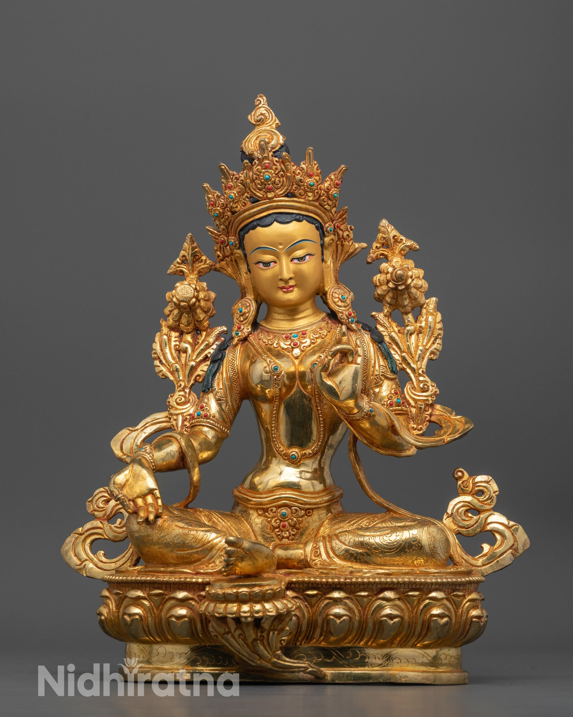 Full image of Hand-carved Green Tara Statue from Nepal in Bhumisparsha Mudra seated on a lotus base
