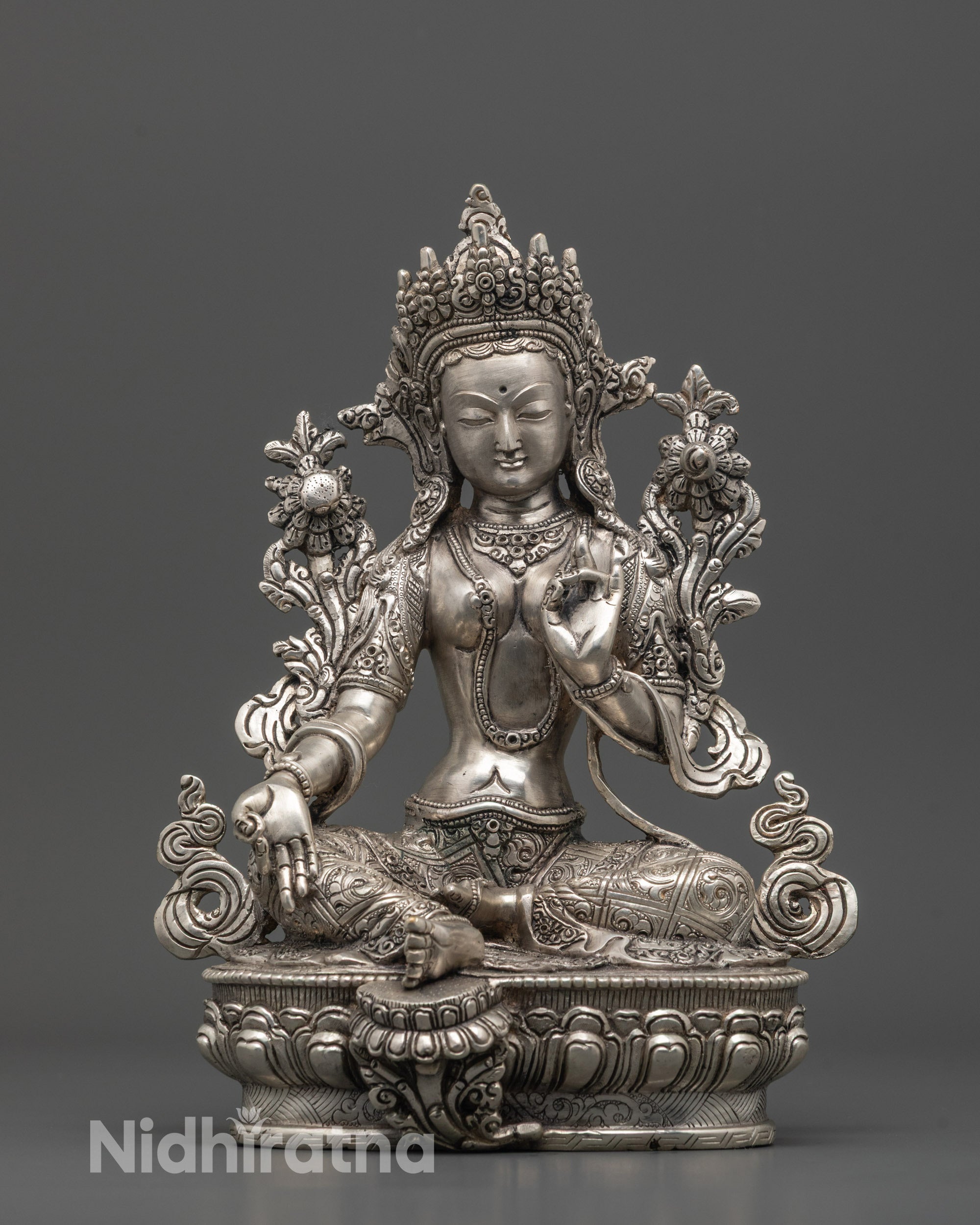 Full image of Hand-carved Green Tara Statue seated on lotus base with varada mudra