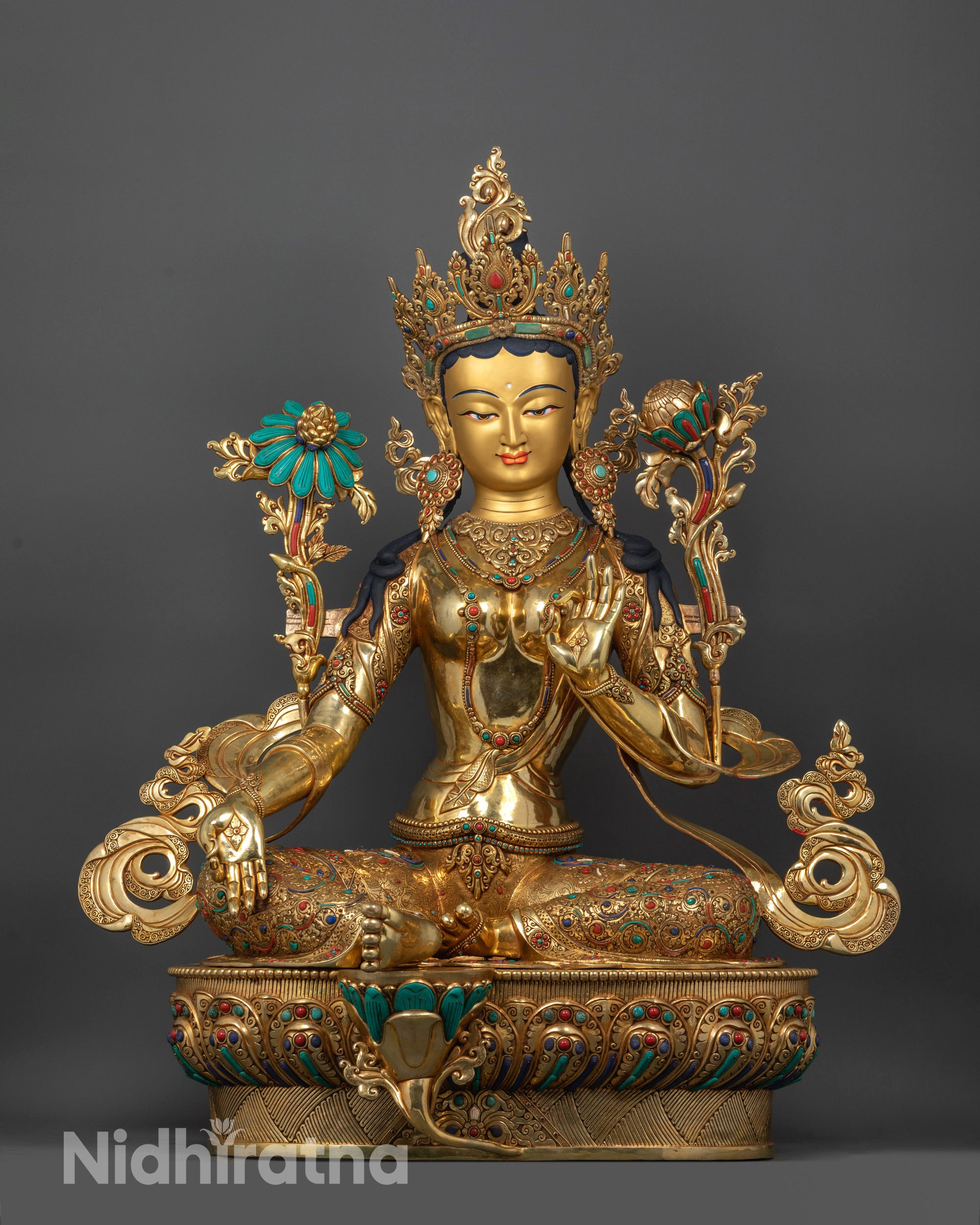 Full image of Hand-carved Green Tara Statue seated on lotus with varada mudra