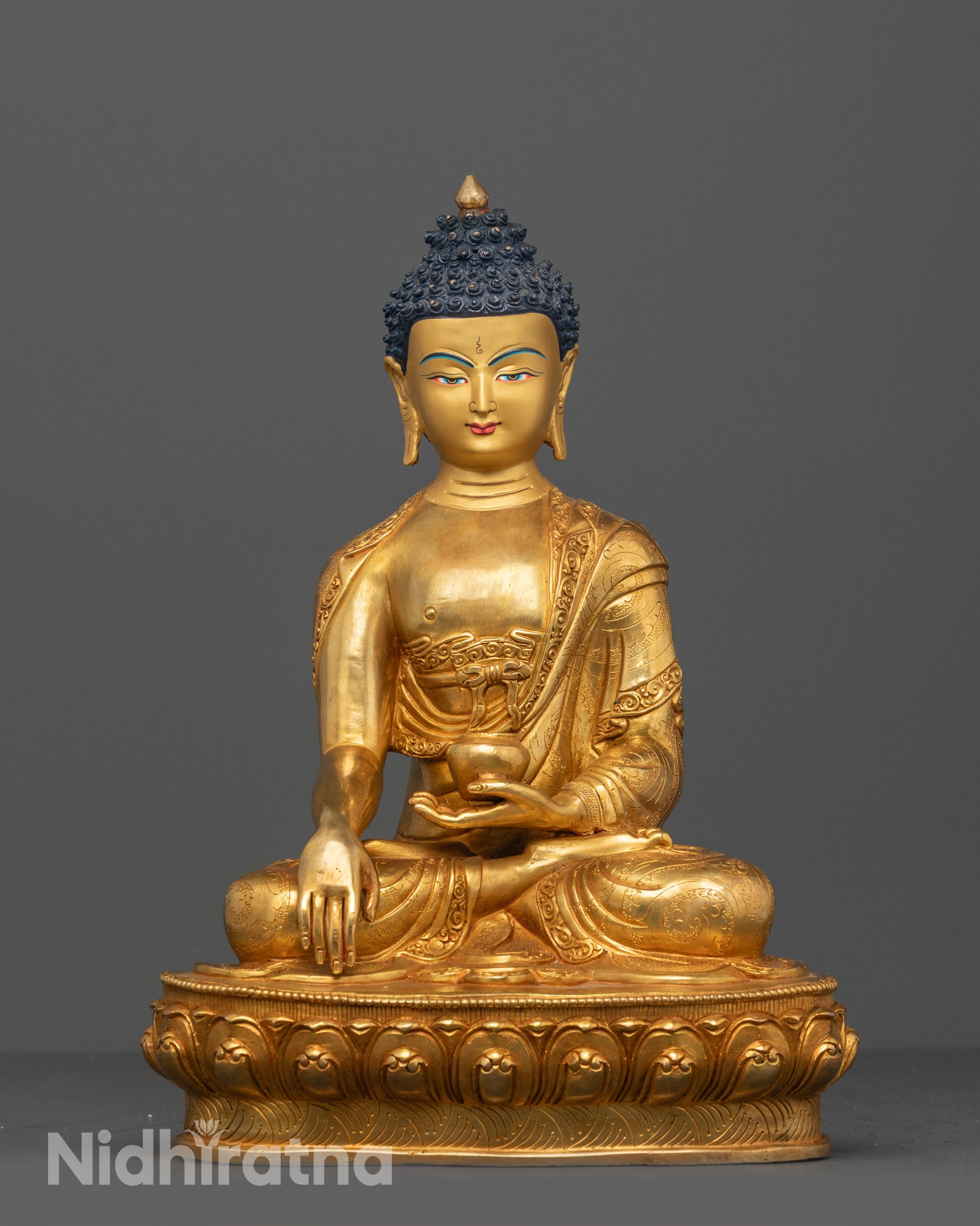 Full image of Hand-carved Shakyamuni Buddha statue seated on lotus base with monk’s bowl
