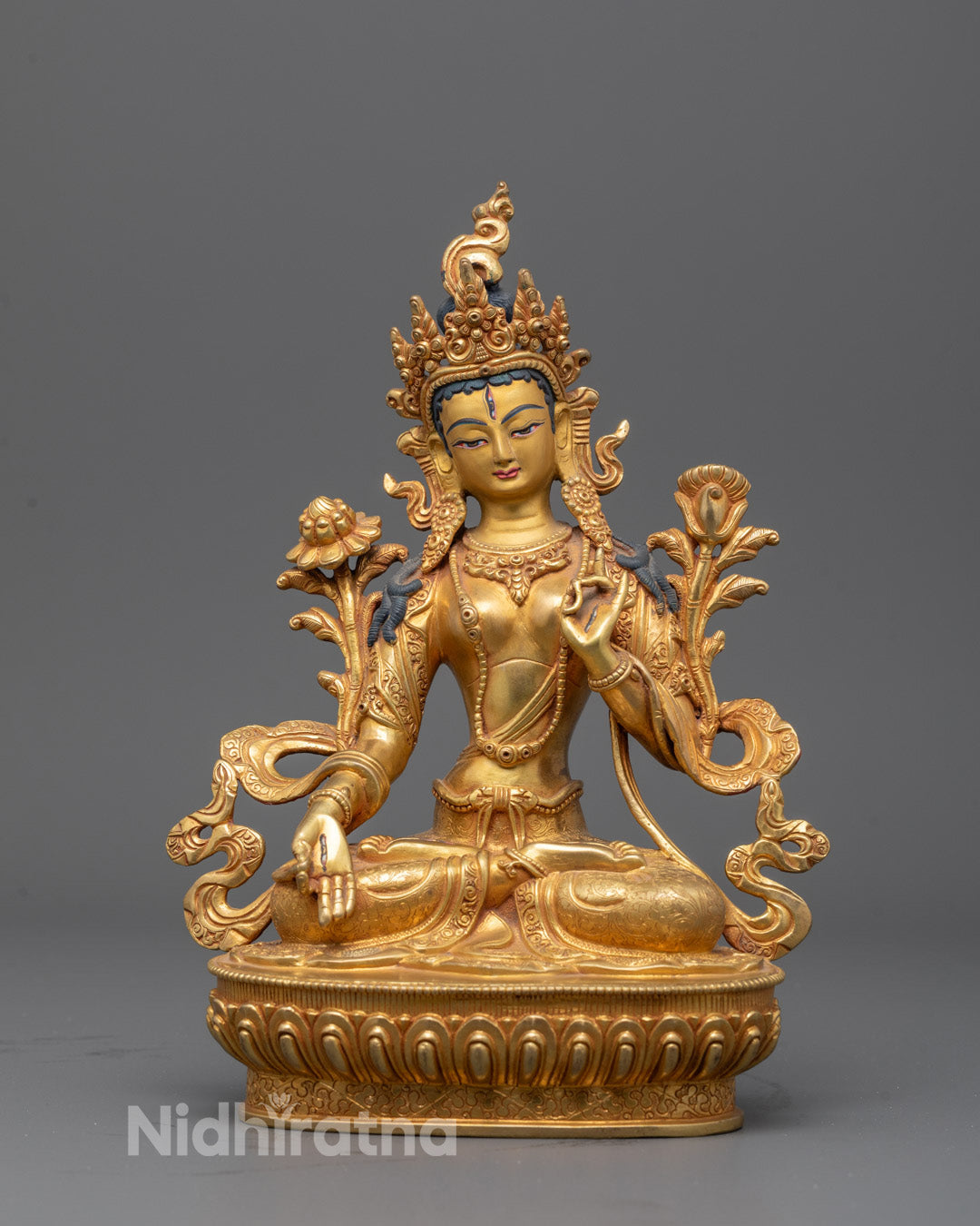 Full image of Hand-carved White Tara statue seated in lotus posture with seven eyes