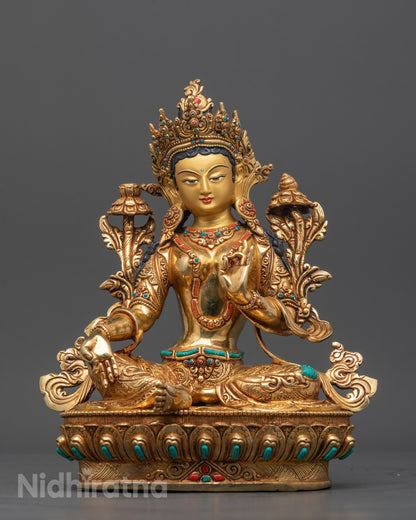 Front view of Nepalese Green Tara statue with gold gilding for meditation