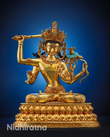 Full view Maha Manjushri statue seated on double lotus seat with gold fire-gilded surface.
