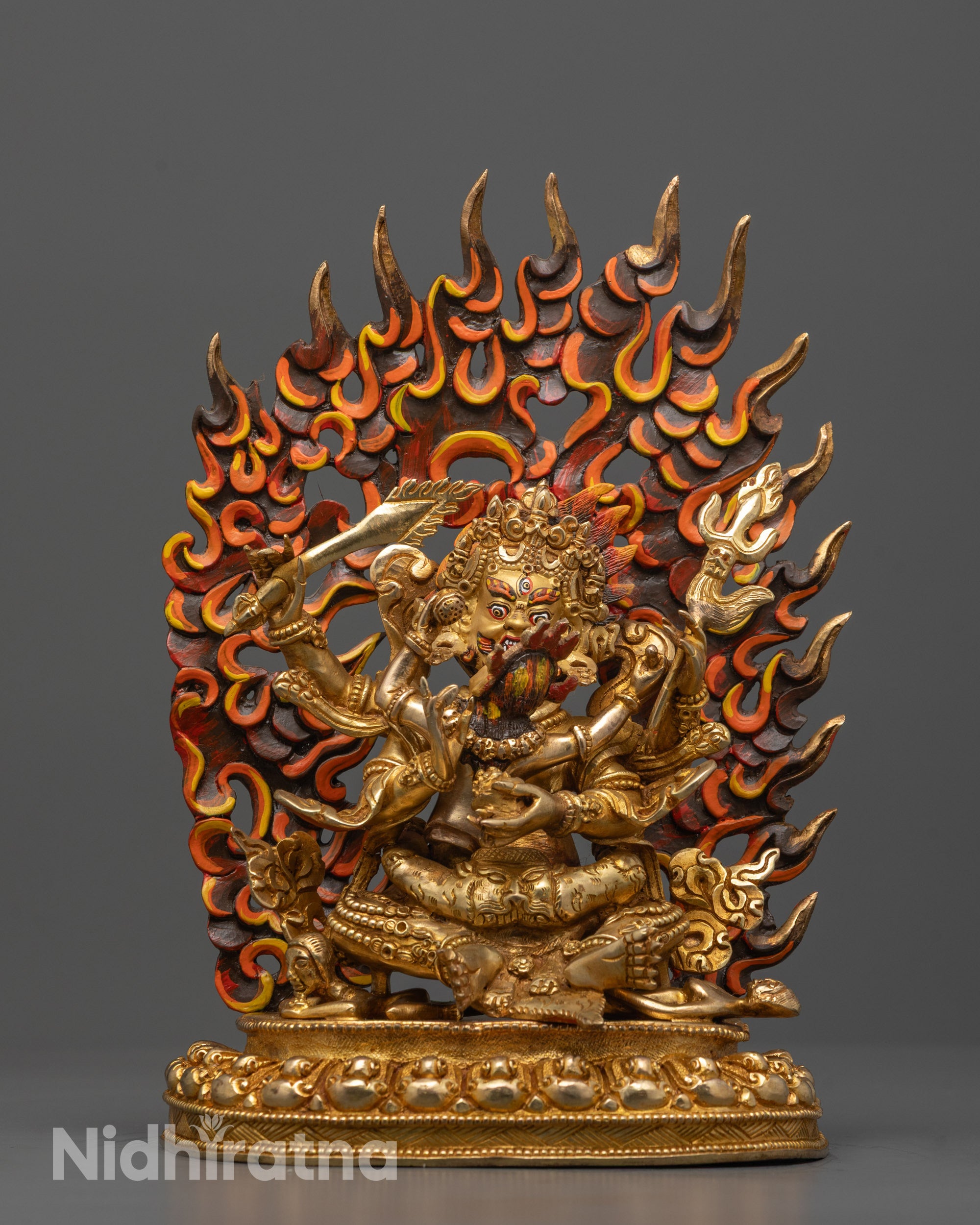 Full view of Four Armed Mahakala Consort Statue seated on lotus base holding a sword 