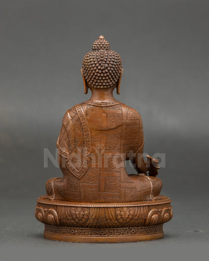 Full view of Nepalese Medicine Buddha sculpture highlighting intricate artistry, lotus throne, and symbolic healing elements for meditation