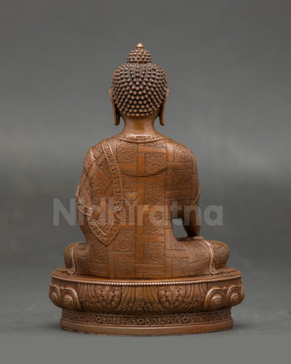 Full view of Sacred Shakyamuni Buddha sculpture highlighting oxidized finish, traditional robes, and spiritual devotion for meditation