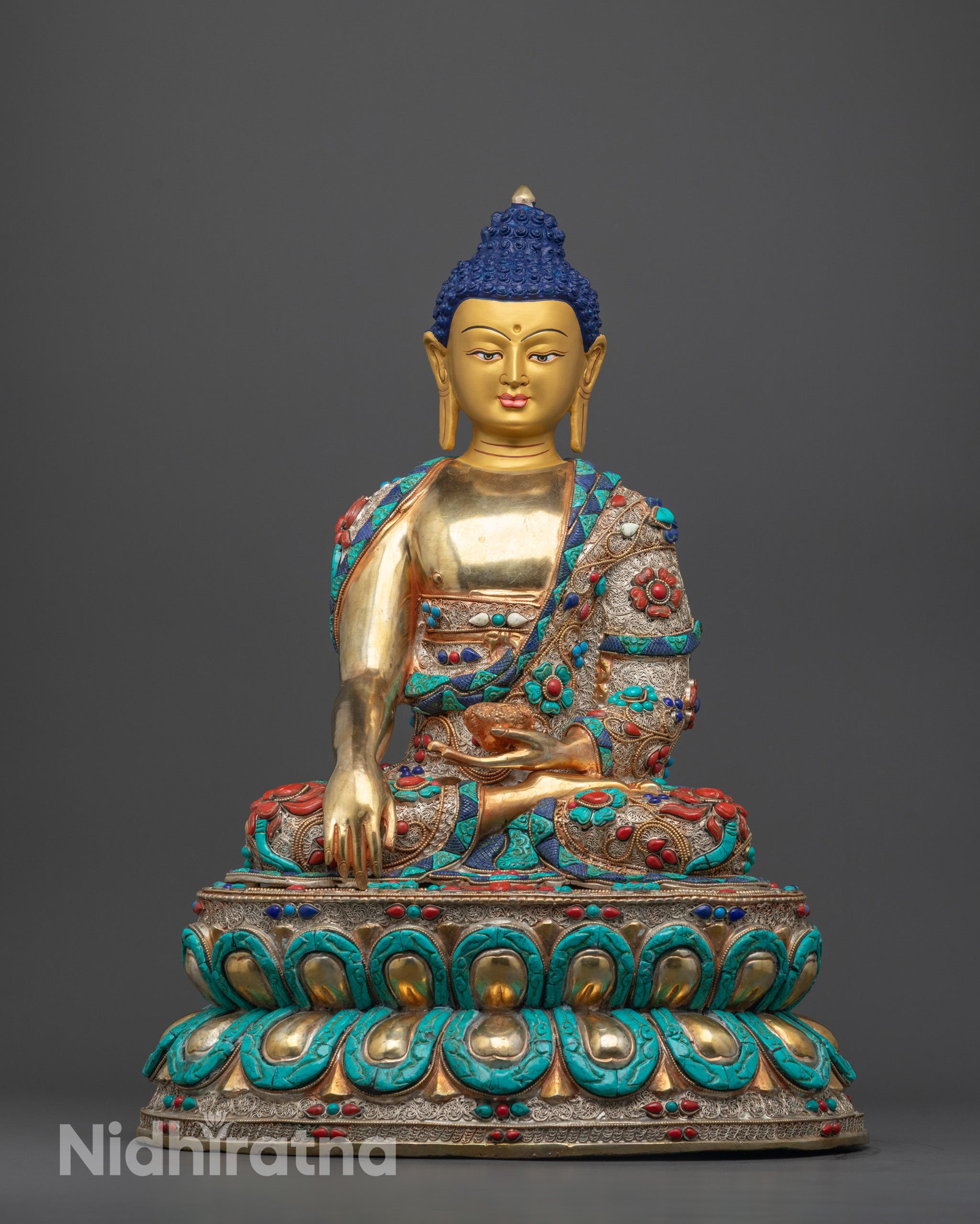 Full view of Shakyamuni Buddha Statue seated on lotus throne holding a monk’s bowl